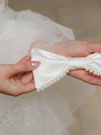 Nœud pour cheveux en satin avec perles