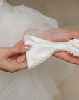 Nœud pour cheveux en satin avec perles
